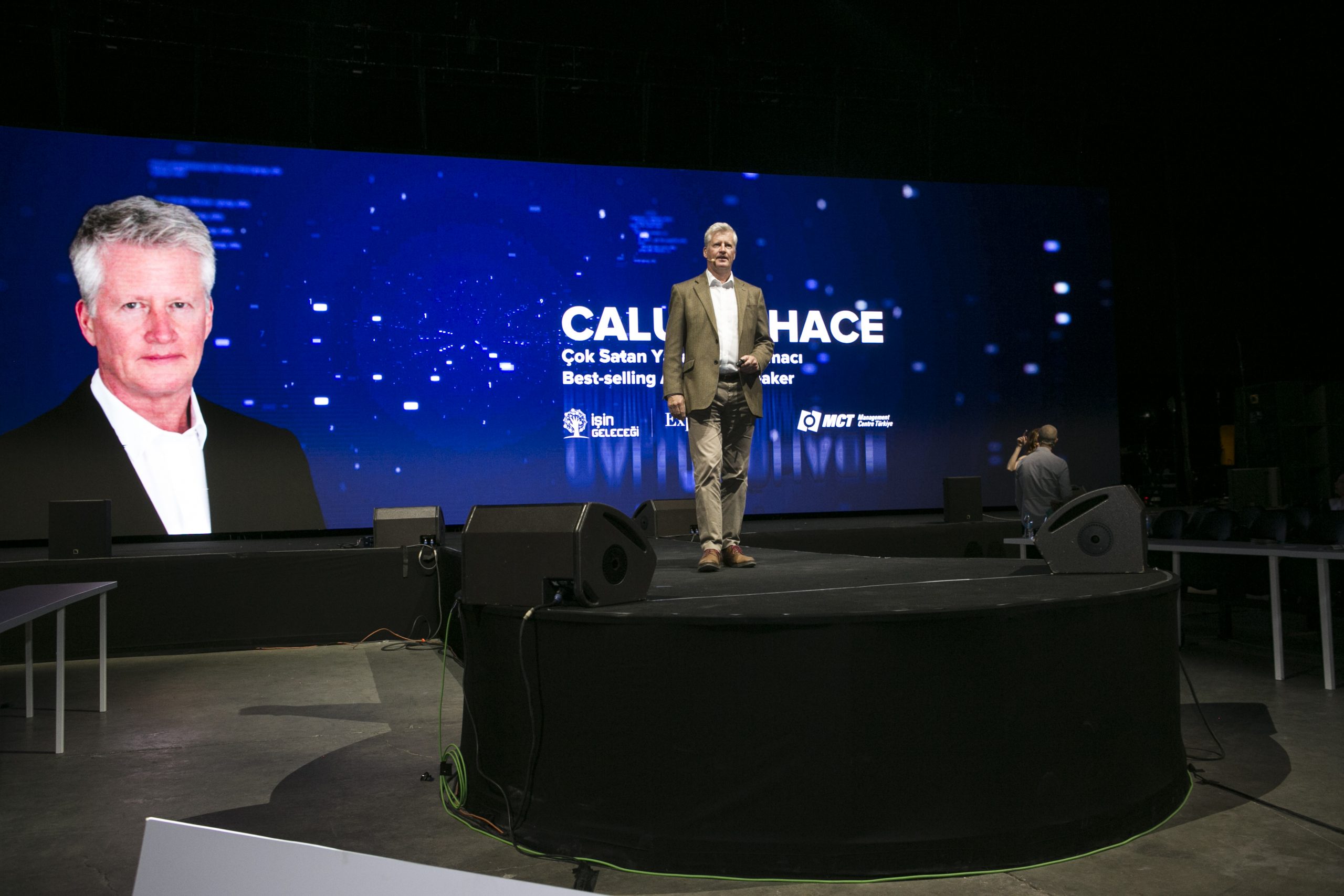 Calum Chace at speaking event on stage.